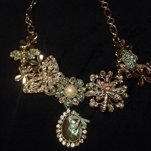 Intricate flower and insect necklace